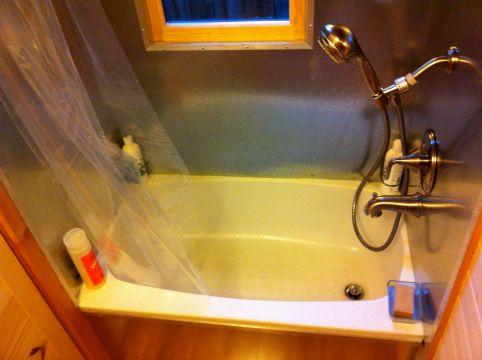 Gina's shower and bath with custom metal walls
